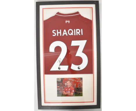 Xherdan Shaqiri framed montage comprising a signed Liverpool &lsquo;96 replica shirt, mounted in box frame with colour photo,