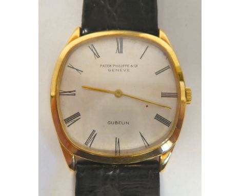 A Patek Philippe 18ct gold cased Gubelin wristwatch, faced by a Roman dial, on a black hide strap&nbsp; boxed with Certificat