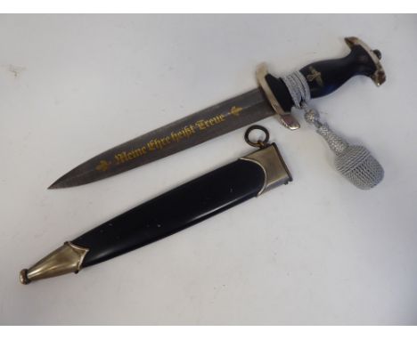 A German Nazi SS dagger and a silvered knot, the black handle with emblems, the Eichhorn blade with a gilded damascus motto&n