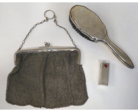 An early 20thC German lady's white metal chain mail evening purse; and a contemporary white metal moulded hair brush; and a l