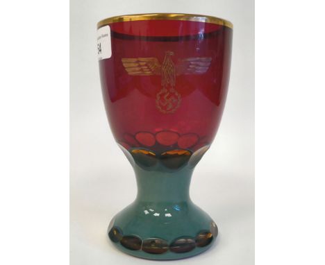 A German Nazi red and green, ruby coloured and cut glass goblet&nbsp; bearing an inscribed emblem (Please Note: this lot is s