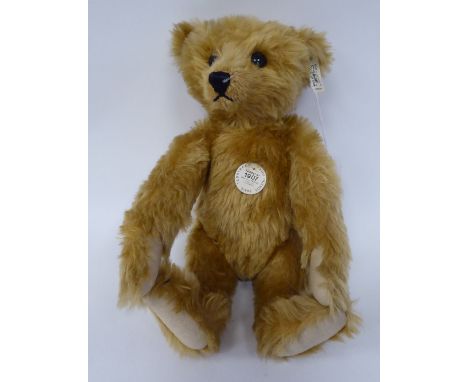 A Steiff 1907 replica golden plush mohair covered Teddy bear with a mobile head, limbs, a stitched nose and a growler&nbsp; 1