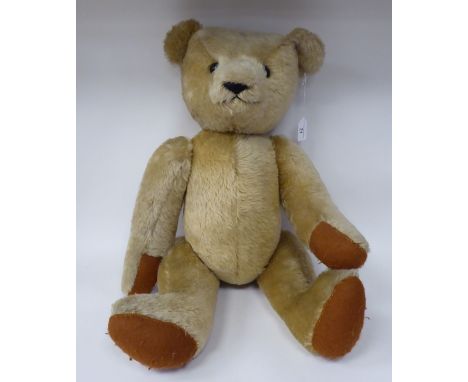 A pale coloured mohair Teddy bear with a mobile head, limbs and a stitched nose&nbsp; 24"h