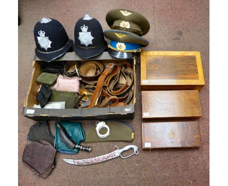 A mixed lot: to include military and other belts and straps; two Russian military peaked caps; and British police helmets (Pl