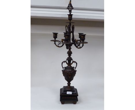 A modern bronze finished metal, five branch candelabra of urn design with a marble plinth&nbsp; 31"h&nbsp; 118"spread