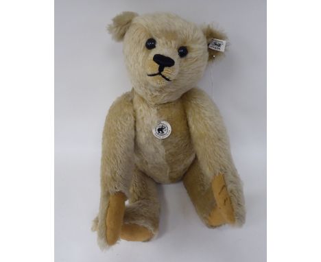 A Steiff 1907 replica mohair covered Teddy bear with a mobile head, limbs and a stitched nose&nbsp; 16"h