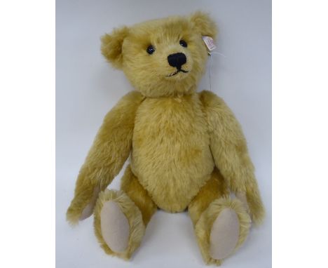 A Steiff golden plush mohair covered Teddy bear with a mobile head, limbs, a stitched nose and a growler&nbsp; 17"h