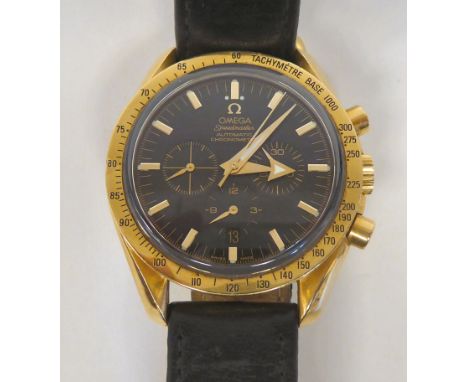 An 18ct gold Omega Speedmaster automatic chronometer, faced by a black baton dial with seconds and three subsidiaries, on a d