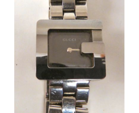 A lady's Gucci stainless steel cased bracelet wristwatch&nbsp; stamped 007 8286 &amp; 3800L, faced by a plain black dial