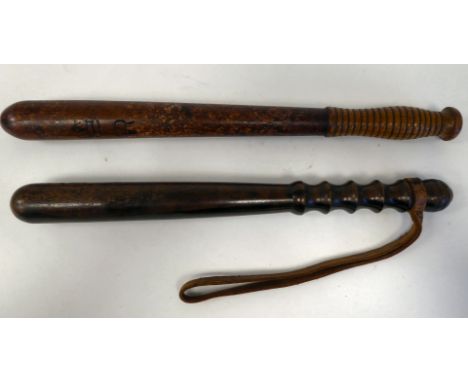 A Victorian oak truncheon of tapered form with a ribbed, elliptical handgrip&nbsp; 17.5"L; and another, in lignum vitae, bear