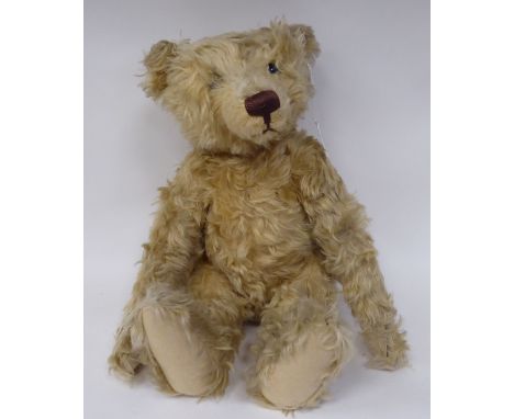 A Steiff mahogany mohair covered Teddy bear with mobile limbs and a stitched nose&nbsp; 19"h