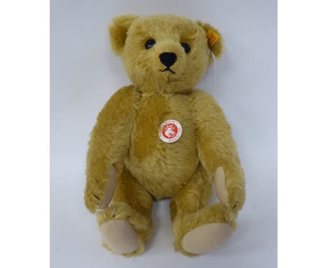 A Steiff golden plush mohair covered Teddy bear with mobile limbs, stitched nose and a growler&nbsp; 12"h