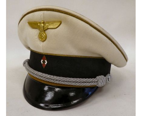 A German Hitler Youth Leaders peaked cap with emblems (Please Note: this lot is subject to the statement made in the Auctione