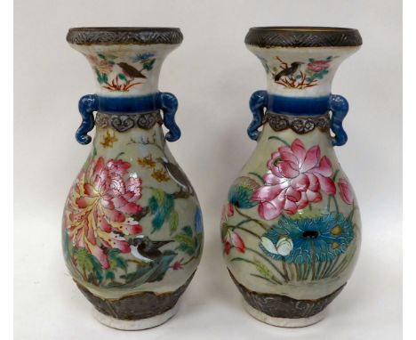 A pair of 20thC Chinese porcelain vases of ovoid form, each with moulded flank handles, a narrow neck and flared cup rim, dec