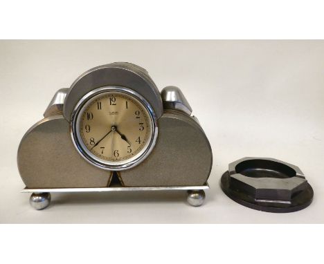 A Sterling alloy cased mains electric mounted timepiece, manufactured from component parts as used in the Gypsy engine which 