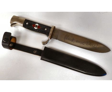 A Hitler Youth knife with a textured two-part handgrip and an enamelled emblem, the RZM blade with a motto&nbsp; 5.5"L in a b