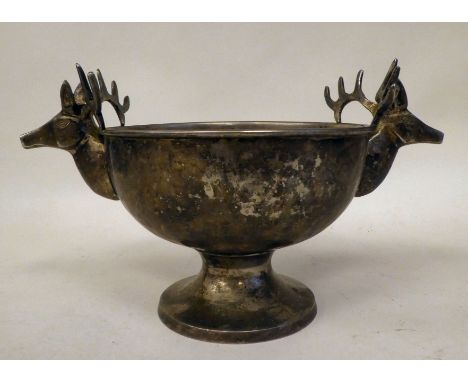 A German white metal hunting trophy bowl with opposing stags head handles, on a pedestal base&nbsp; 9"dia