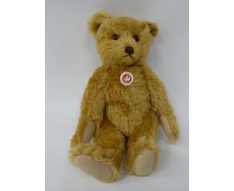 A Steiff golden plush mohair covered Teddy bear with mobile limbs and a stitched nose&nbsp; 15"h