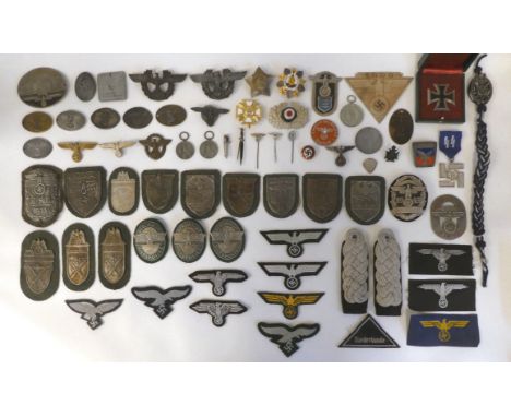 A miscellany of German Nazi era badges: to include a Motorstaffel NSKK; and other embroidered uniform emblems (Please Note: t