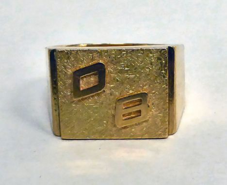 A yellow metal signet ring