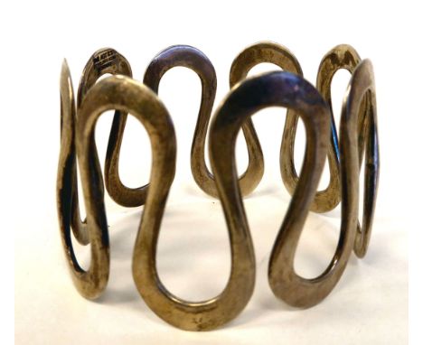 An Anna Greta Eker silver Curves bangle&nbsp; bears an impressed mark