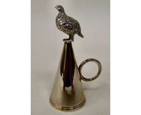 A modern silver cone shape candle extinguisher with a ring handle, surmounted by grouse&nbsp; Brian Leslie Fuller&nbsp; Londo