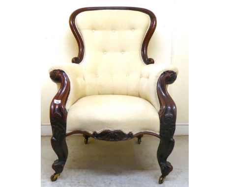 A late Victorian carved mahogany showwood framed, waisted spoonback grandfather chair with enclosed arms, part button upholst