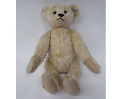 A Steiff pale mohair covered Teddy bear with mobile limbs, a stitched nose and a growler&nbsp; 17"h