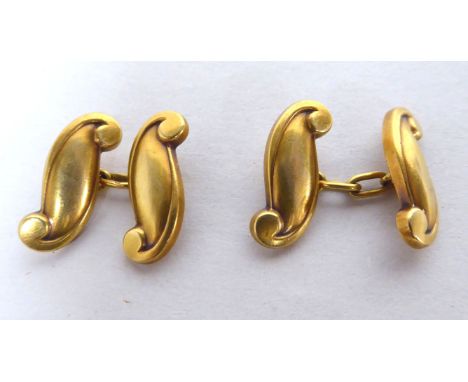 A pair of yellow metal cufflinks