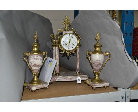 A MARBLE AND GILT METAL CLOCK GARNITURE, the white enamel dial bearing black Arabic numerals and painted garlands, raised on 