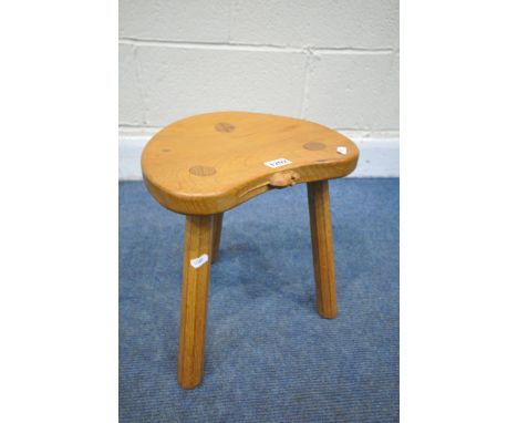 ROBERT 'MOUSEMAN' THOMPSON OF KILBURN, AN EARLY TO MID 20TH CENTURY OAK THREE LEGGED STOOL, on octagonal legs (condition repo