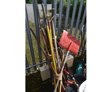 A SELECTION OF VARIOUS GARDENING TOOLS, to include shovels, rakes, brushes, etc, and a self-propelled lawn mower (condition -
