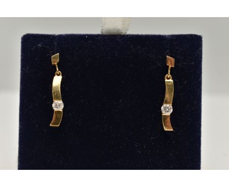 A PAIR OF 18CT GOLD DIAMOND DROP EARRINGS, each of a polished curved bar set with a round brilliant cut diamond, each approxi