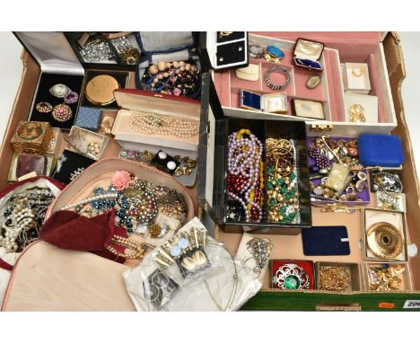 TWO BOXES OF COSTUME JEWELLERY, to include a cream jewellery box, an old First Aid tin box containing costume jewellery, bead