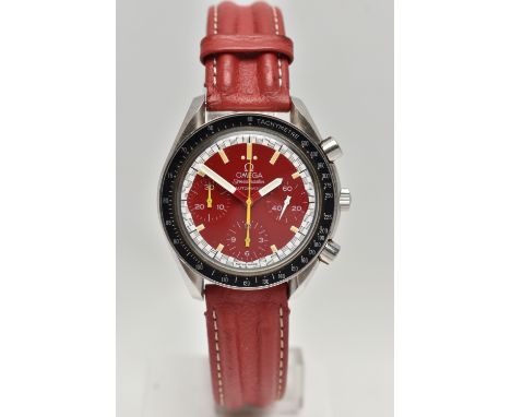 AN OMEGA SPEEDMASTER REDUCED RACING RED MICHAEL SCHUMACHER EDITION WRISTWATCH, red dial with three subsidiary dials, signed '