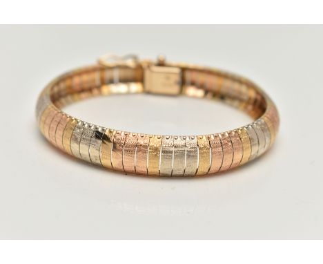 AN ITALIAN TRI COLOUR ARTICULATED BRACELET, a domed bracelet with textured and foliage detail, fitted with an integrated box 