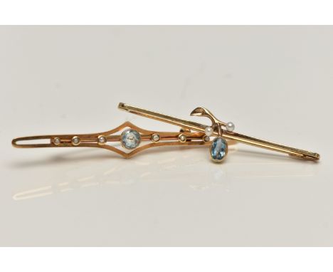 TWO EARLY 20TH CENTURY BROOCHES, the first centring on a circular cut aquamarine, milgrain collet set, to an open work polish
