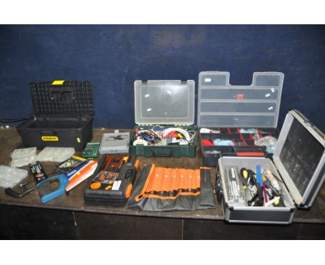 FOUR PLASTIC TOOLBOXES AND TRAYS CONTAINING HAND TOOLS including spanners, screwdrivers, saws, drill bits, a Challenge toolki