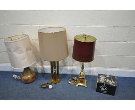 THREE TABLE LAMPS, to include a brass column lamp, a French style brass lamp, a stoneware lamp, all with fabric shades, and a