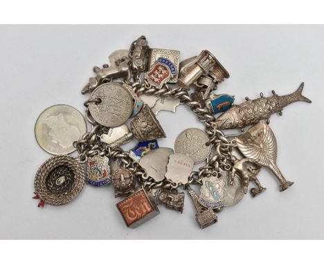 A SILVER CHARM BRACELET, curb link bracelet, links stamped with a sterling mark, fitted with approximately thirty nine charms