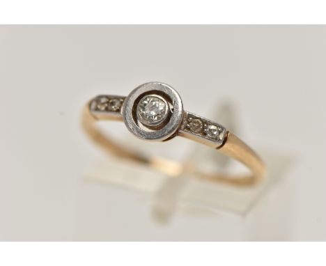 A YELLOW METAL DIAMOND RING, central old cut diamond, collet set in a white metal mount, flanked with single cut diamond set 