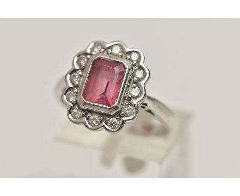 AN 18CT WHITE GOLD, PINK TOURMALINE AND DIAMOND CLUSTER RING, designed with a rectangular cut pink tourmaline collet set to t