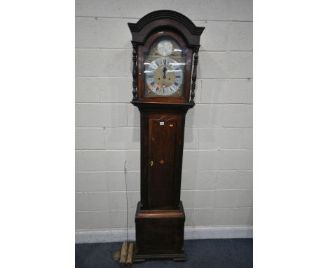 A GEORGIAN MAHOGANY EIGHT DAY LONGCASE CLOCK, the hood with turned pillars, flanking a glazed door that is enclosing an 11 in