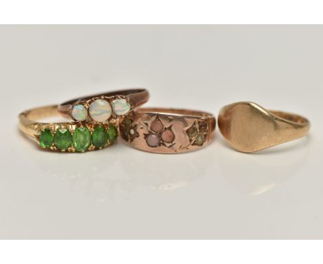 FOUR RINGS, to include a 9ct gold polished circular signet ring, hallmarked 9ct Birmingham, ring size I, an early 20th centur
