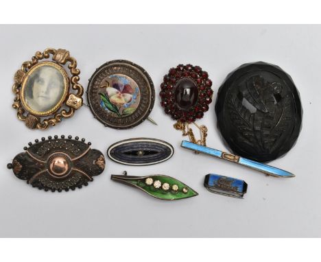A SELECTION OF BROOCHES, to include an 'Arthur Johnson Smith' enamel lily of the valley brooch, hallmarked Birmingham, a smal