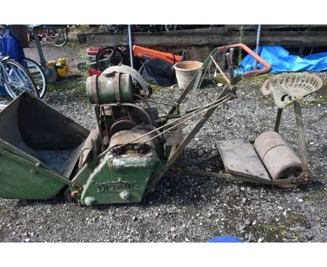 A DENNIS PETROL CYLINDER RIDE ON LAWN MOWER, with grass box and starting handle (engine moves freely but not started, rusty a