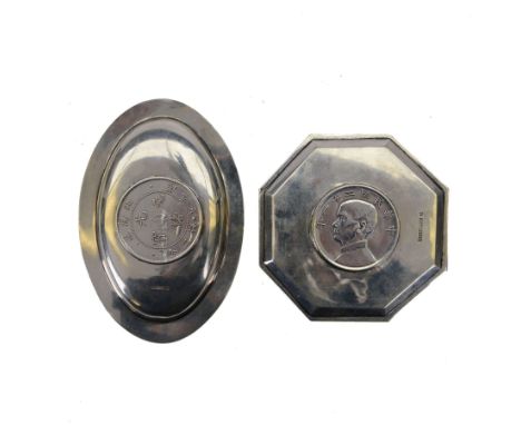 Two Chinese silver dishes both inset with coins, the first an octagonal example with a 'birds over jung' silver dollar, stamp