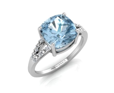 A beautiful cushion cut blue topaz 3.54 carats surrounded by twelve round brilliant cut diamonds on the shoulders in this 9ct