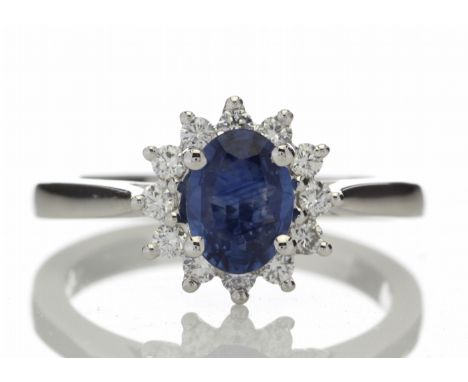 Classic but vintage inspired, this stunning 18ct white gold sapphire and diamond cluster set ring is a fashion faithful.  Set