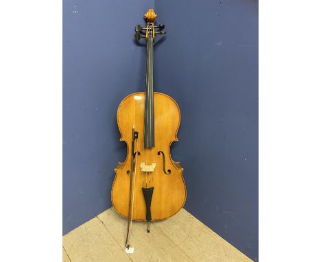 Cello, the body measuring 123 cm long, label inside "made in Hungary", condition - some general wear and a bow 